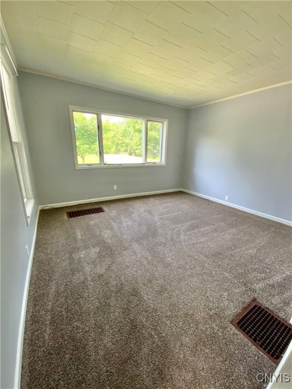 carpeted spare room with ornamental molding