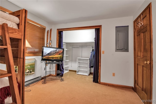 unfurnished bedroom featuring a closet, baseboard heating, light carpet, and electric panel