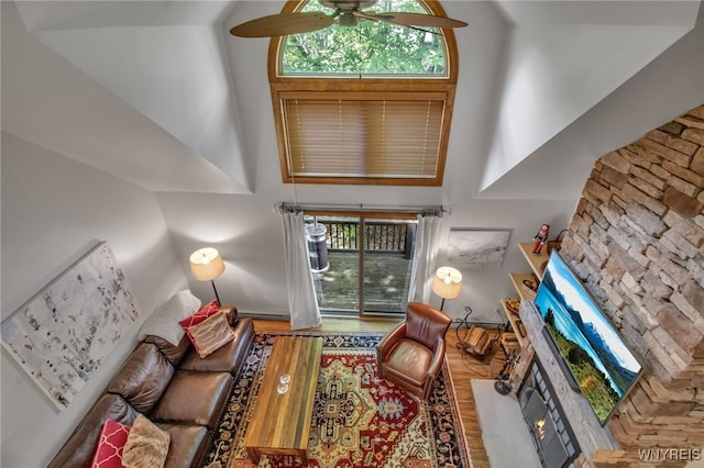 living room featuring ceiling fan and hardwood / wood-style flooring