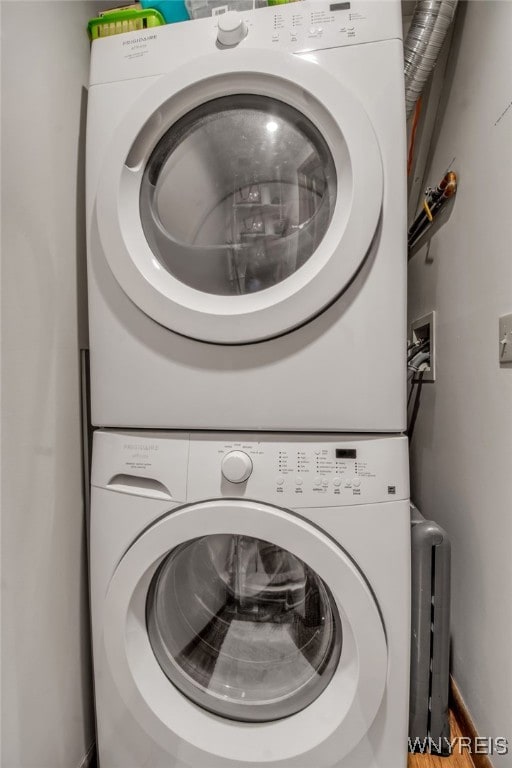 laundry area with stacked washer / drying machine