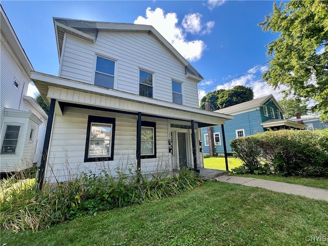 view of front facade featuring a front yard and a porch