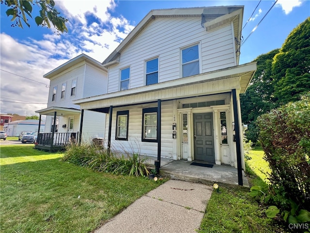 view of front property with a front lawn and a porch