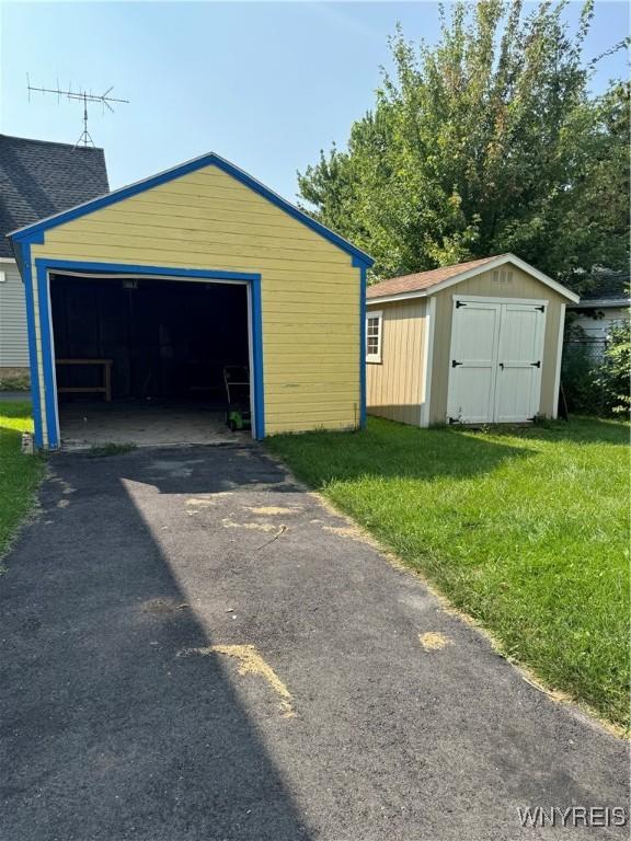 garage with a lawn