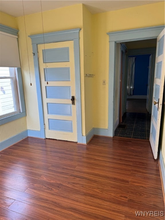 entryway with hardwood / wood-style floors