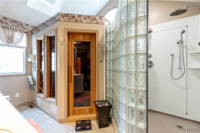 bathroom featuring tile patterned flooring and walk in shower