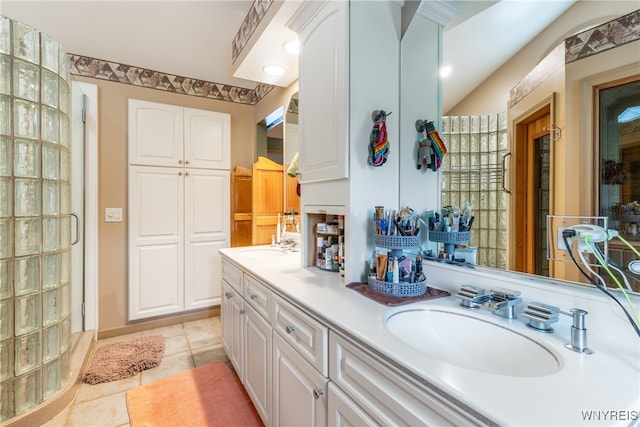 bathroom featuring dual vanity and tile patterned flooring