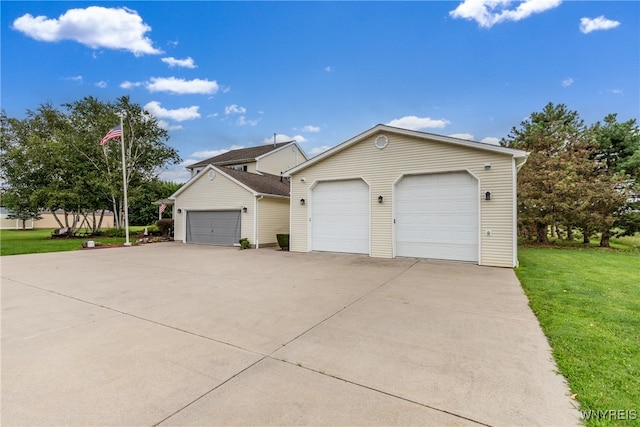 view of front of house with a front yard and a garage