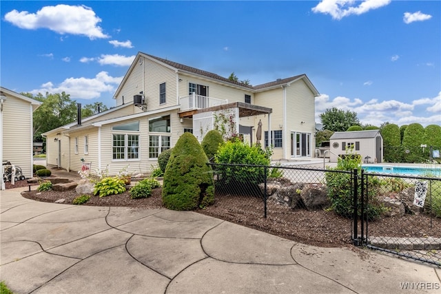 view of front of house featuring a fenced in pool