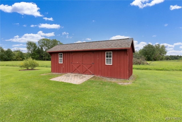 view of outdoor structure with a yard