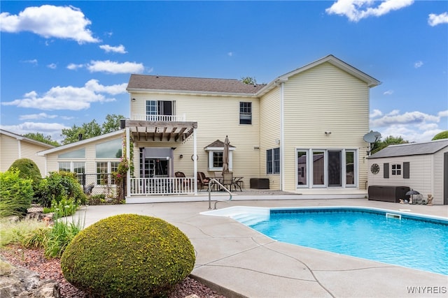 rear view of house featuring a patio area and a pergola