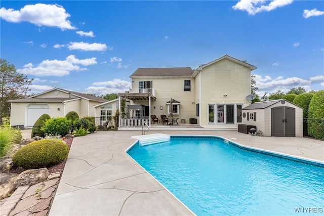 view of pool with an outdoor structure and a patio area