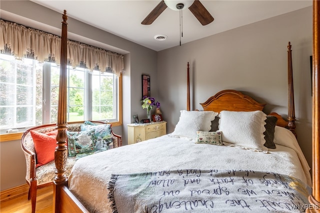 bedroom featuring ceiling fan and hardwood / wood-style flooring