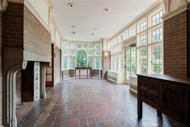 unfurnished sunroom featuring a wealth of natural light