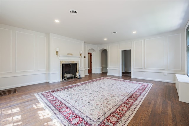 unfurnished living room featuring dark hardwood / wood-style floors