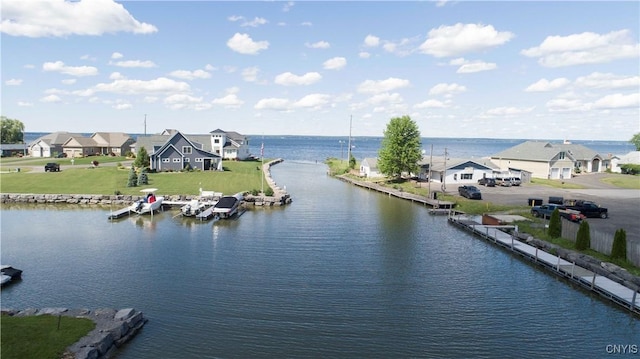 view of water feature with a residential view and a boat dock