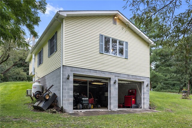 exterior space with a garage and a yard