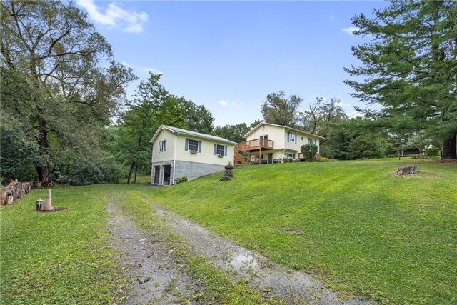 view of yard with a wooden deck