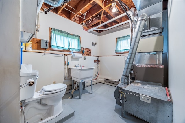 bathroom featuring toilet and concrete flooring