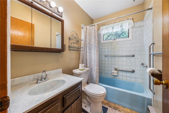 full bathroom featuring tile patterned floors, toilet, vanity, and shower / tub combo