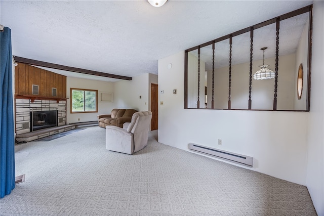 living room with a baseboard radiator, a fireplace, a textured ceiling, and carpet flooring