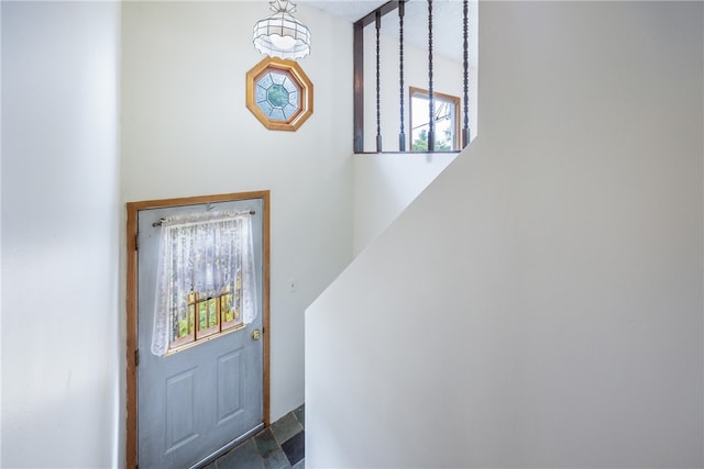 doorway to outside featuring tile patterned flooring