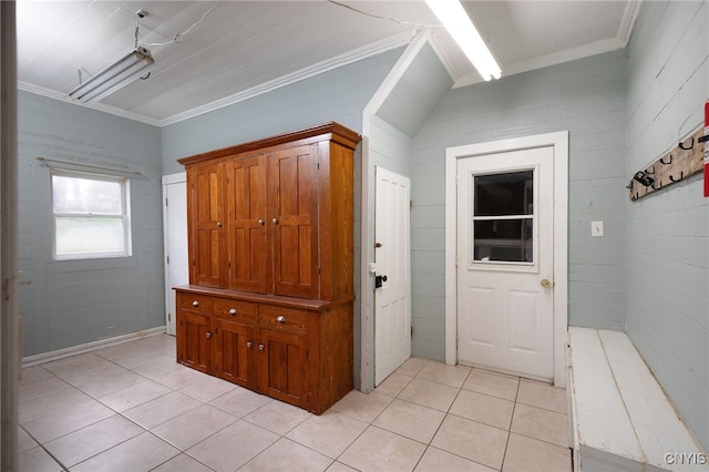 entrance foyer featuring ornamental molding and light tile patterned floors