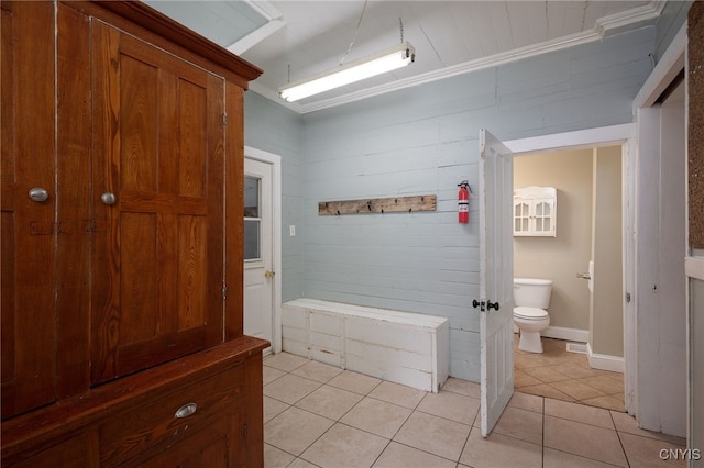 bathroom with toilet and tile patterned floors