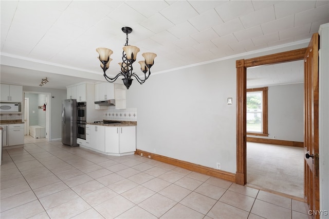 interior space featuring light tile patterned floors, under cabinet range hood, appliances with stainless steel finishes, and decorative backsplash