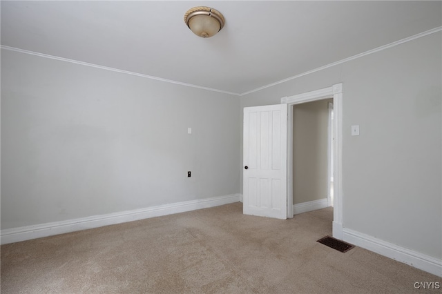 interior space with ornamental molding, visible vents, carpet floors, and baseboards