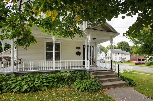 view of front of home featuring a porch and french doors