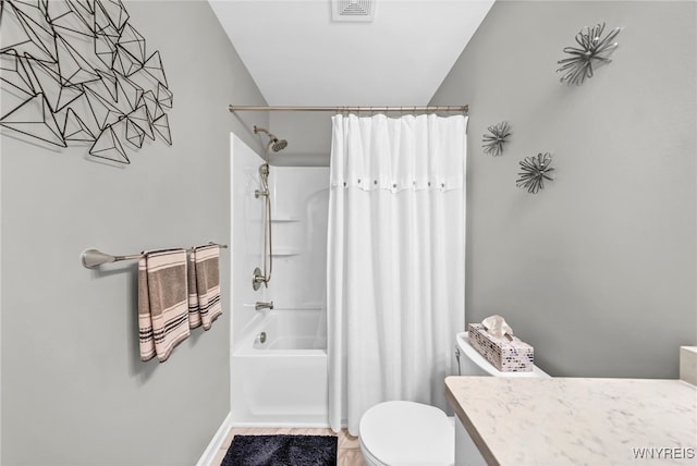 full bathroom featuring vanity, toilet, and shower / tub combo with curtain