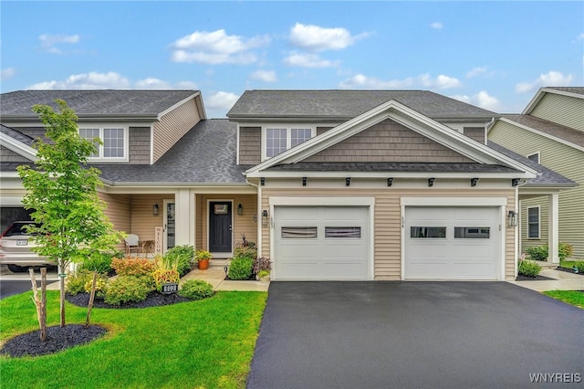 craftsman-style house with a front lawn and covered porch