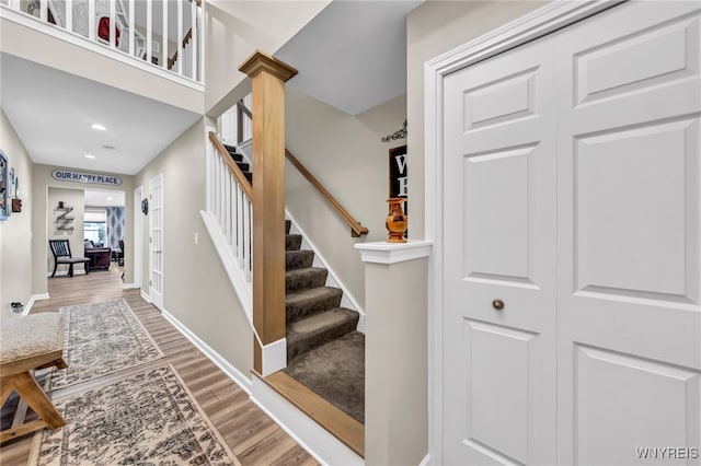 stairway featuring hardwood / wood-style floors