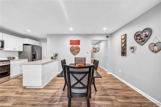 dining room featuring light hardwood / wood-style floors