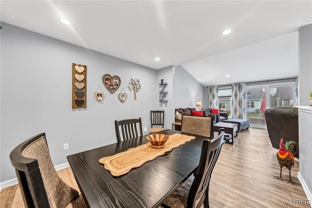 dining space with light hardwood / wood-style floors