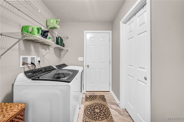 laundry room with washing machine and dryer