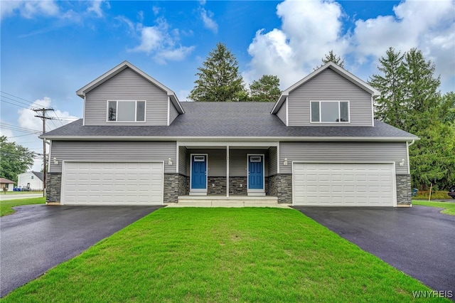 view of front facade with a garage and a front lawn