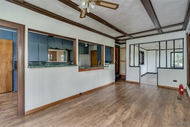 unfurnished living room featuring light wood-type flooring and ceiling fan