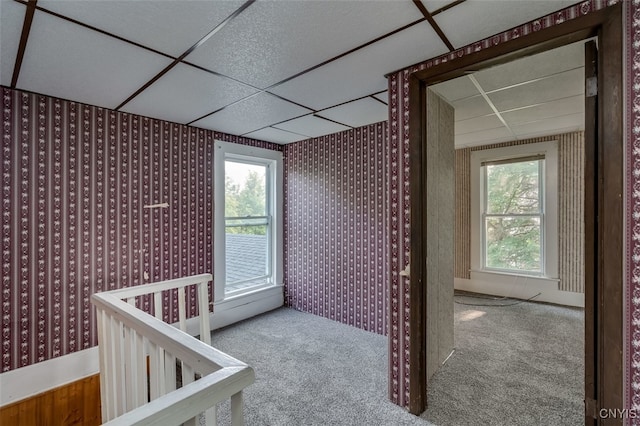 interior space with a drop ceiling and a nursery area