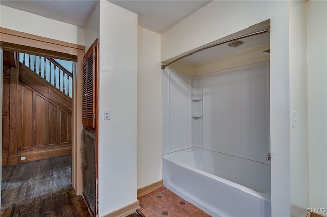 bathroom featuring shower / bathing tub combination and wood-type flooring