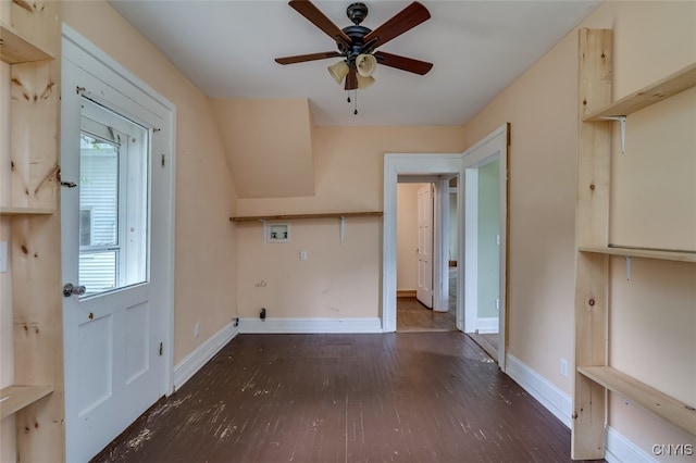 washroom featuring ceiling fan, dark wood-type flooring, and washer hookup