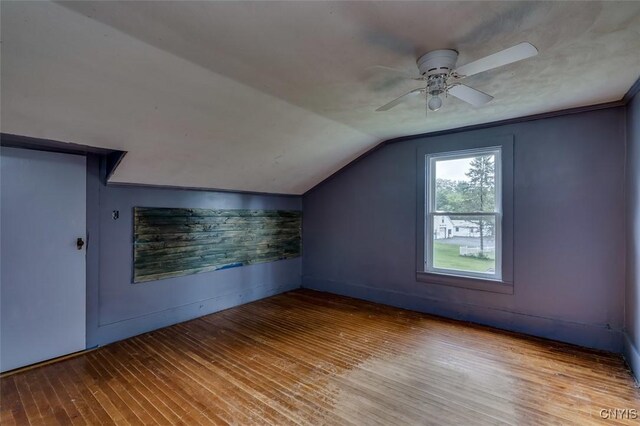 bonus room featuring hardwood / wood-style floors, vaulted ceiling, and ceiling fan