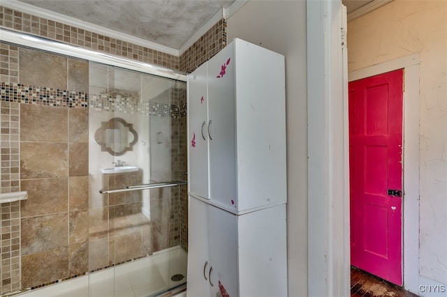 bathroom with crown molding and hardwood / wood-style floors