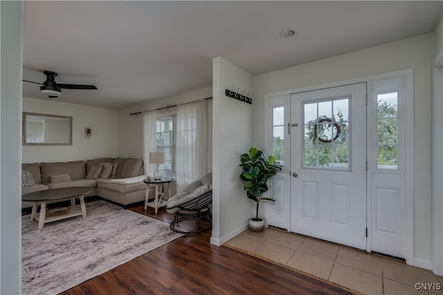 entryway featuring ceiling fan and wood-type flooring