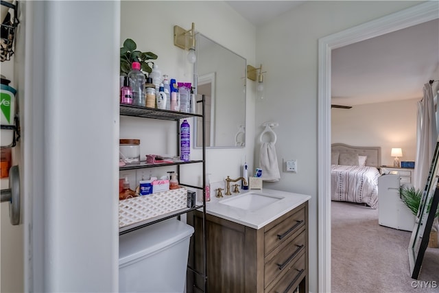 bathroom featuring toilet and vanity