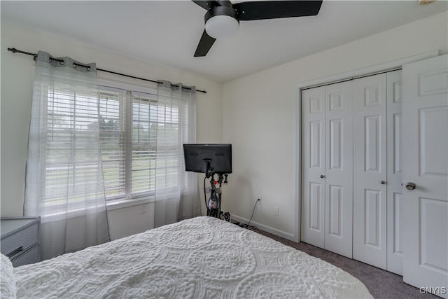 carpeted bedroom with a closet and ceiling fan