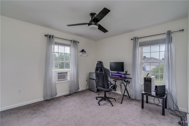 office space featuring ceiling fan, cooling unit, and light colored carpet