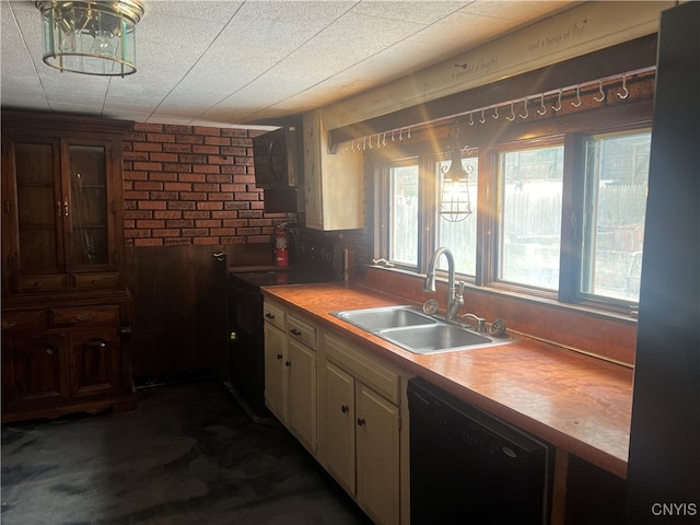 kitchen featuring dishwasher, wood walls, wooden counters, and sink