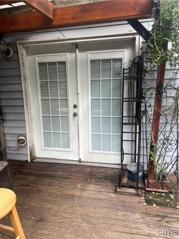 property entrance with a deck