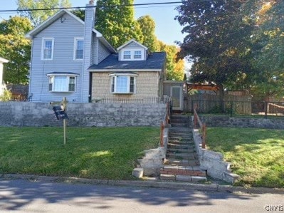 view of front facade with a front lawn